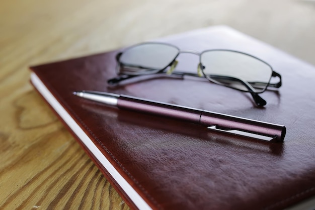 Pen business wallet glasses notebook