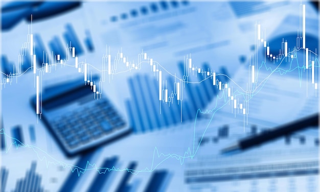 Pen and Calculator on Business Graphs