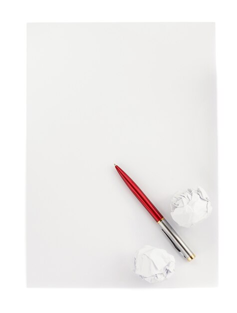 Pen and crumpled paper ball on white background