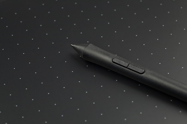 Pen on a graphics tablet, close up.