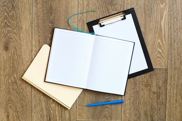 Pen and Notepad on the wooden desk