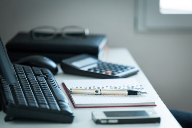 Pen with note on creative office desk