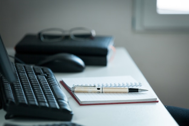 Pen with note on creative office desk