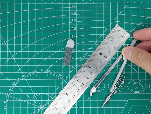 Pencil compass and rulers on cutting mat