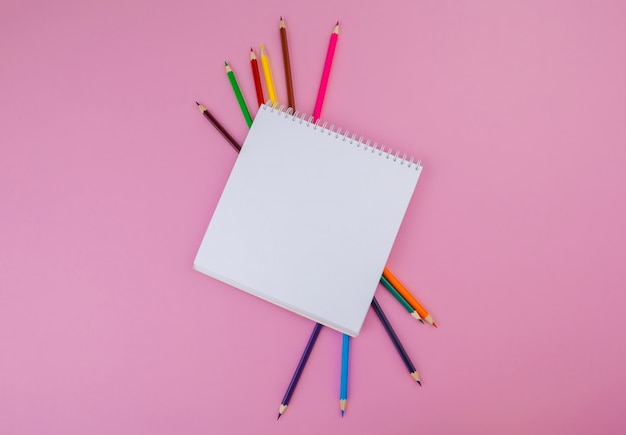 Pencil crayon on a bright pink background. Art concept