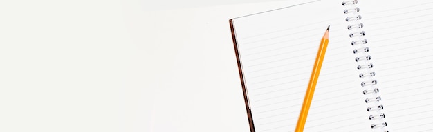 pencil and notebook isolated on a white background