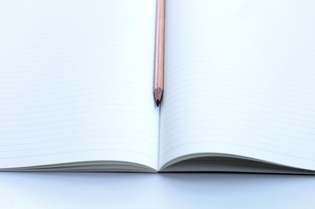 Pencil on notebooks or paper on white background