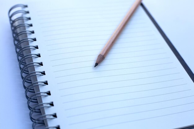 Pencil on notebooks or paper on white background