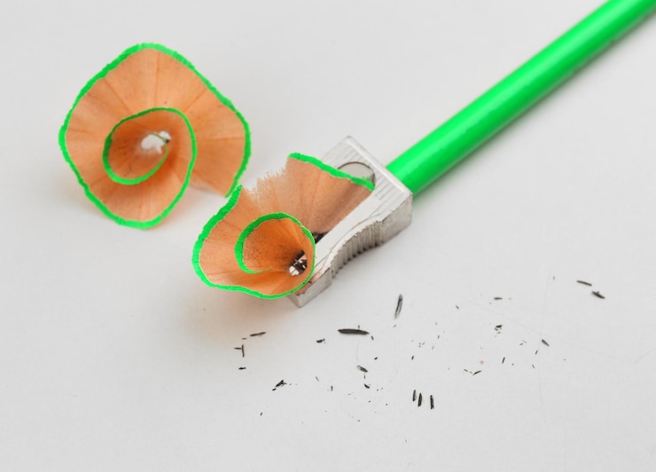 Photo pencil and pencil shavings isolated on white