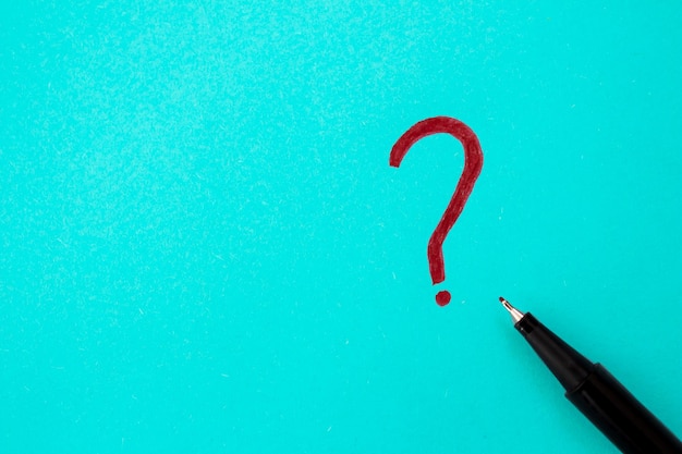 A pencil and a question mark on a blue background