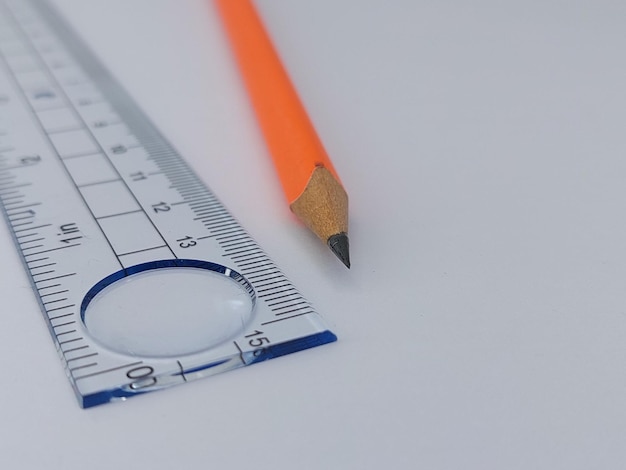 Pencil and ruler on side view