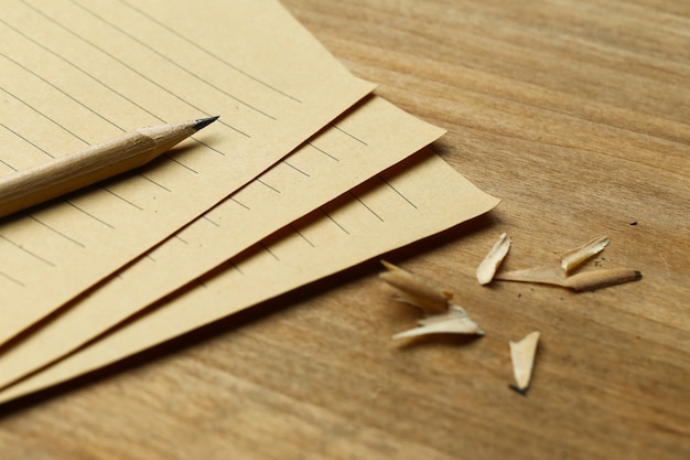 Photo pencil and vintage paper on wooden table