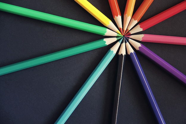 Pencils of different colors close up isolated on black