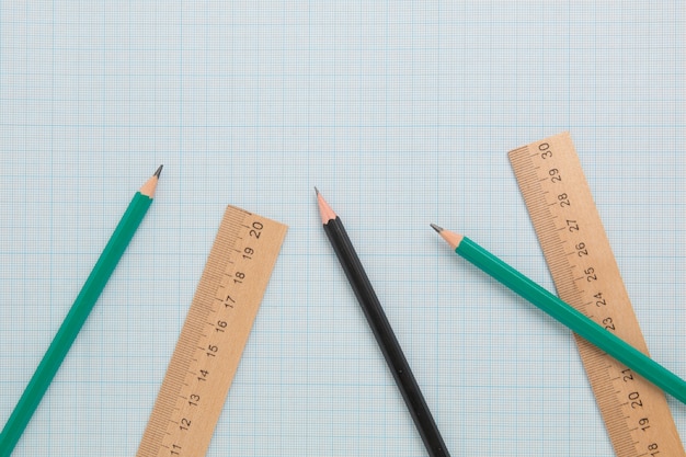 Pencils end engineering ruler on graph paper