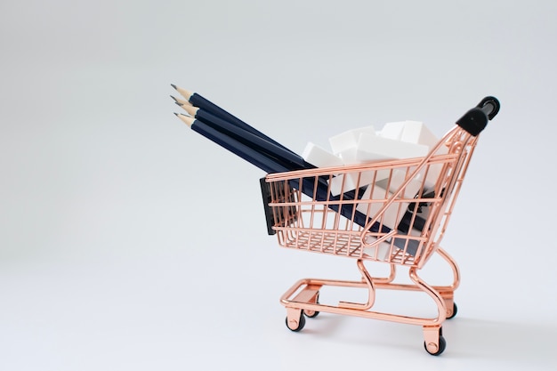 Photo pencils and erasers in the shopping cart