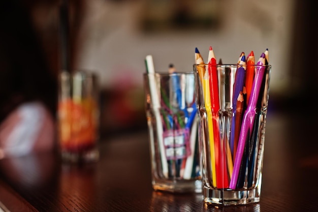 Pencils in glass for drawing on a table