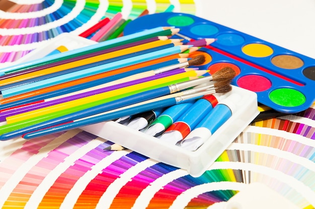 Pencils, paint and color chart of all colors