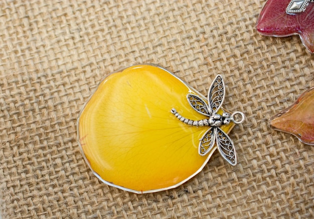 pendant with beautiful flower petal inside resin