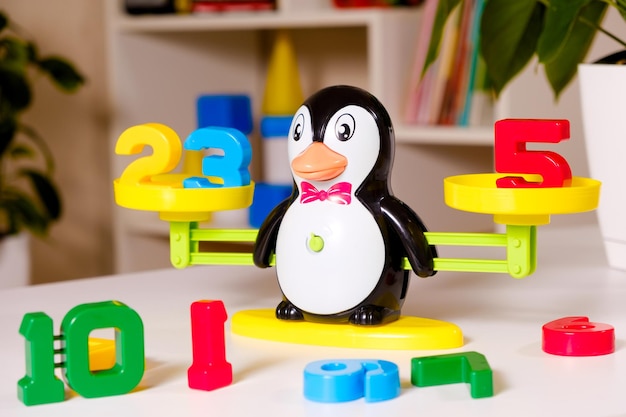 The penguin scale weighs the numbers.