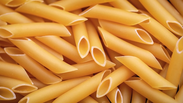 Penne lisce pasta food background