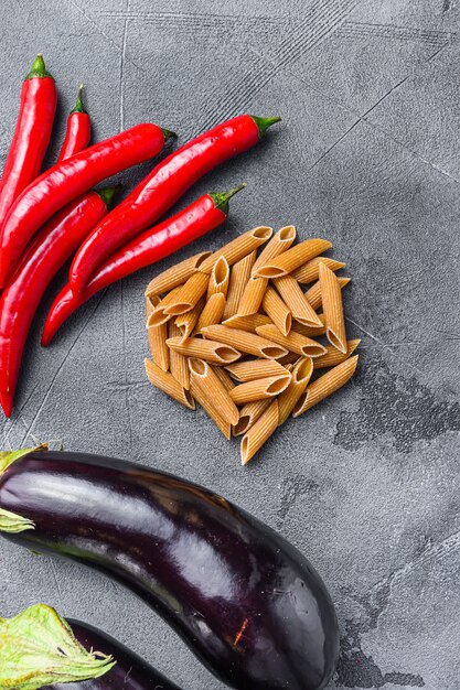 Penne pasta ingredients, eggplant pasta and pepper