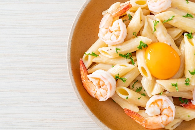 Penne pasta white cream sauce with shrimps and egg