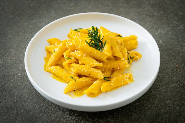 Penne pasta with butternut pumpkin creamy sauce and rosemary