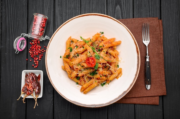 Penne pasta with chili sauce arrabiata in the restaurant