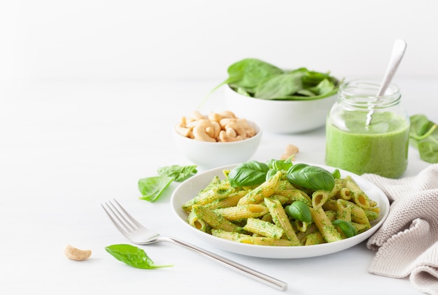 Penne pasta with spinach basil pesto sauce