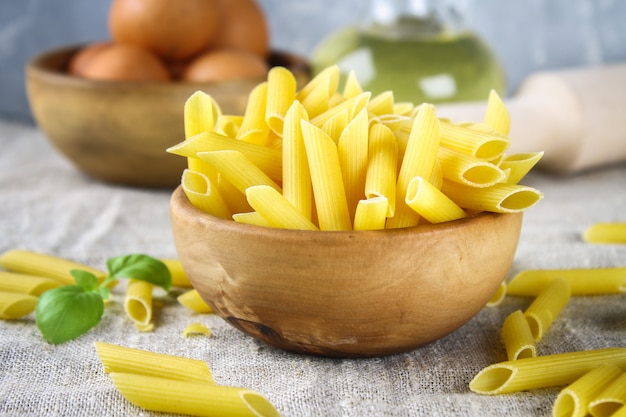 Penne rigate. Macaroni in the form of feathers. mostaccioli pasta. Closeup.