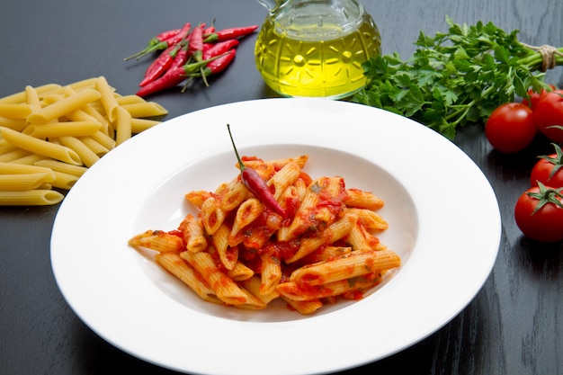 Penne with arrabbiata sauce and fresh ingredients