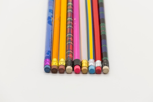 Pens of different colors all with eraser form a rectangle