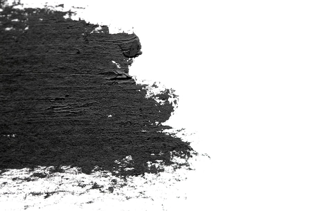 Penseelstreken van zwarte acrylverf close-up De rand van Smeared Black Spot