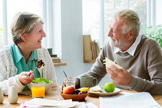 pensioner elderly couple eating brunch concept