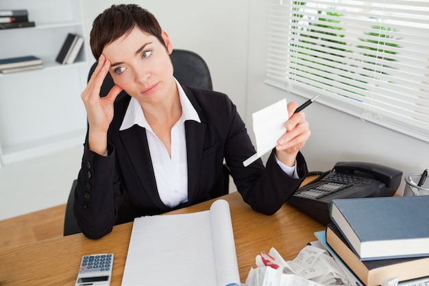 Pensive accountant checking receipts