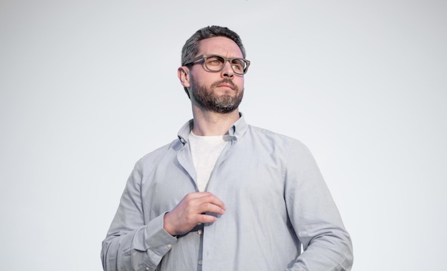 pensive bearded man standing peaceful pensive man in glasses outdoor pensive man on sky background