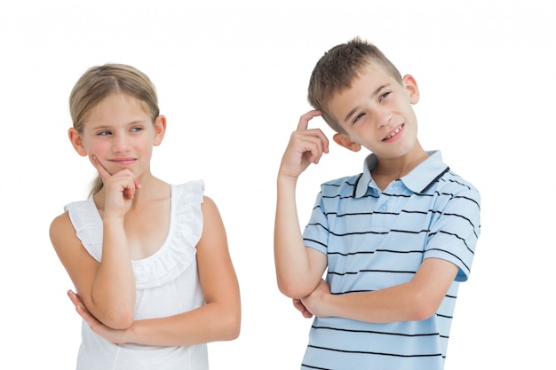 Pensive brother and sister posing together