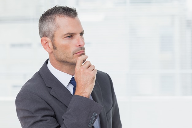 Pensive businessman looking away