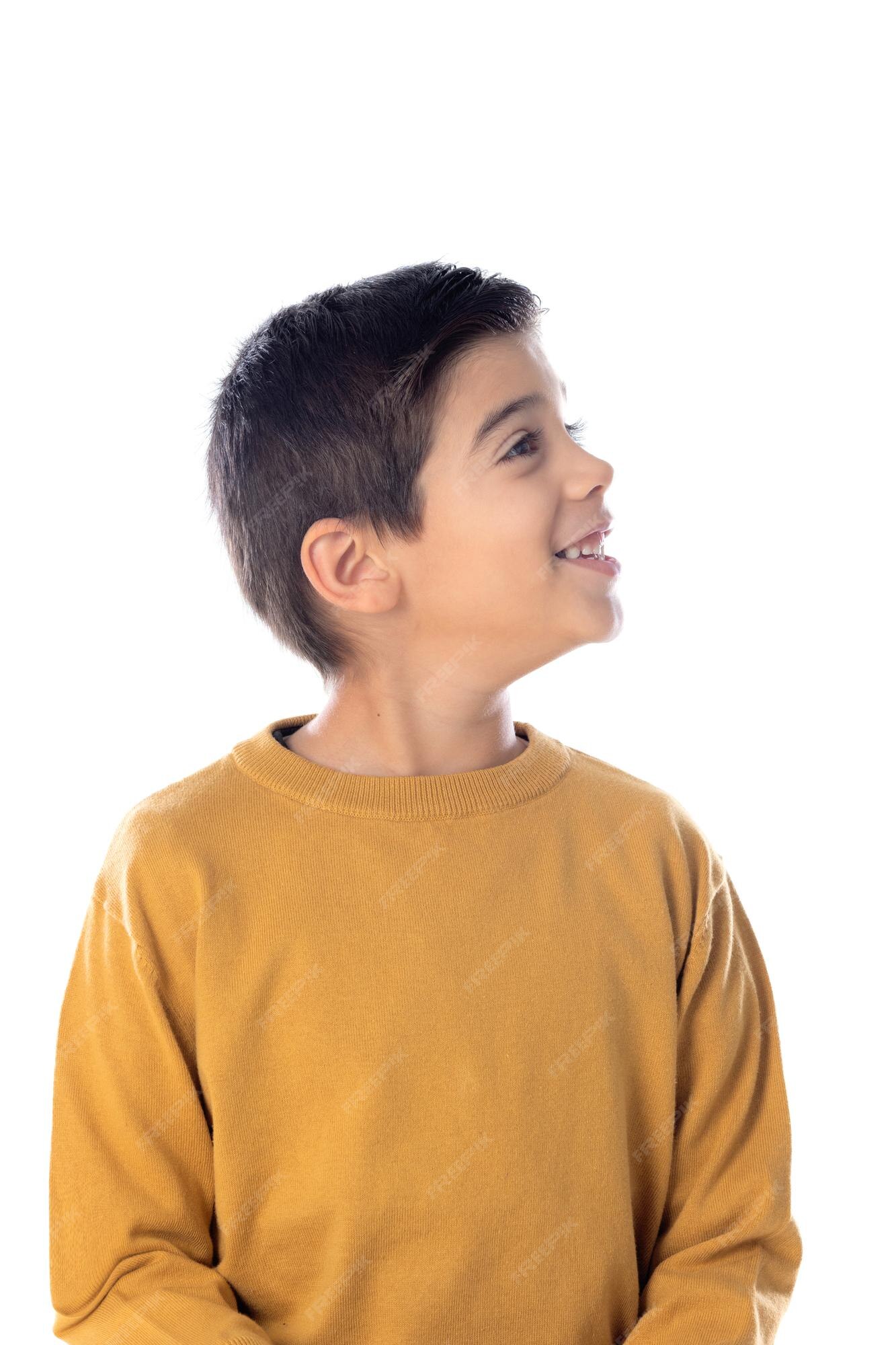 Premium Photo | Pensive cute spanish child with yellow t-shirt isolated