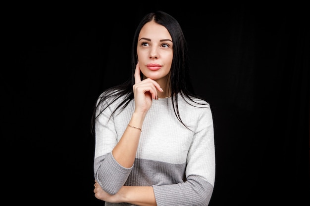 pensive girl in a light sweater