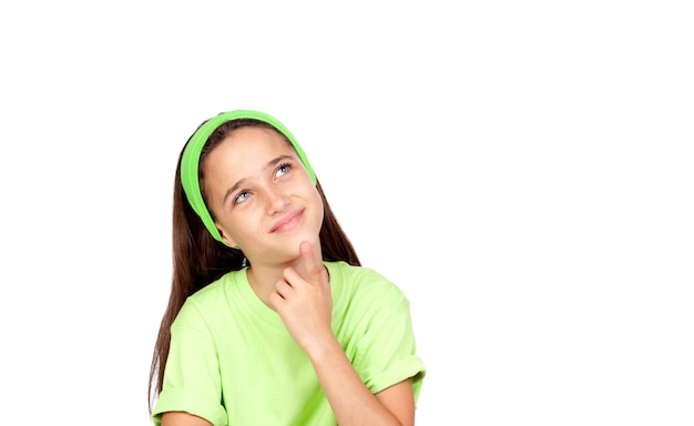 Pensive girl looking upwards isolated on a white