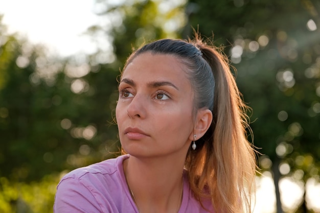 Pensive girl looks into the distance brunette looks into the distance