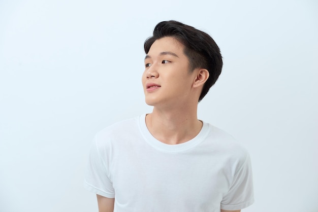 Pensive man smiling isolated over a white background