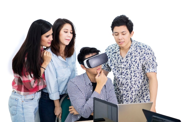 Pensive man uses a VR goggles with his partners