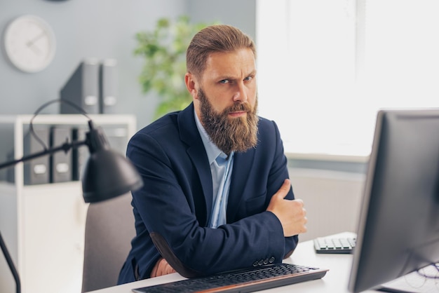 Pensive mature man in stylish business