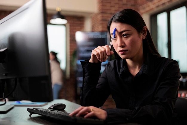 Pensive network engineer reflecting at failed data processing operation and security system unknown breach. Thoughtful software developer thinking of ways to upgrade encryption program.