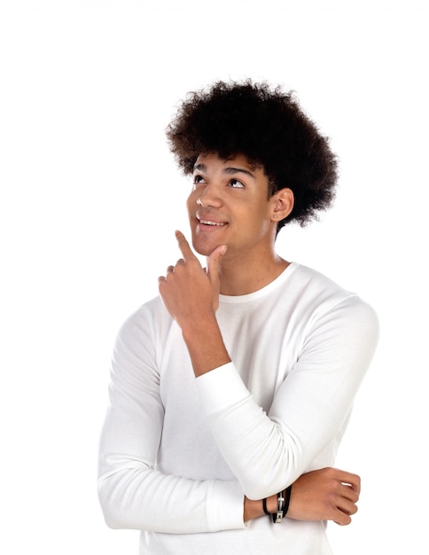 Pensive teenager boy wiht afro hairstyle