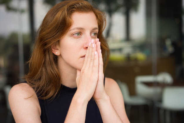 Pensive Woman at Cafe in Deep Thoughts