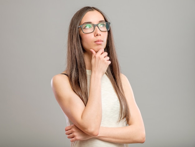 Pensive woman in glasses