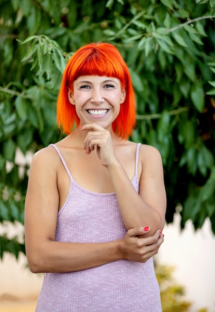 Pensive woman with red hair enjoing a relaxed day